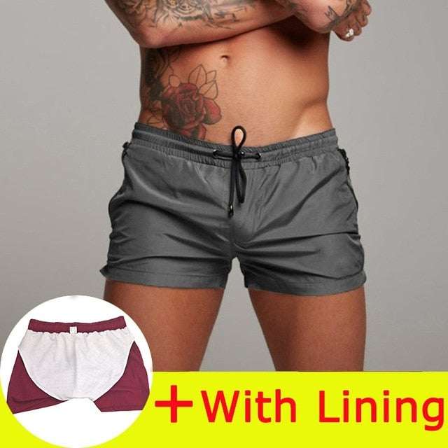 Nuevo traje de baño para hombre, traje de baño Sexy, pantalones cortos de natación para hombre, calzoncillos para hombre, pantalones cortos de playa, trajes deportivos, pantalones cortos para tabla de Surf, bañadores para hombre 